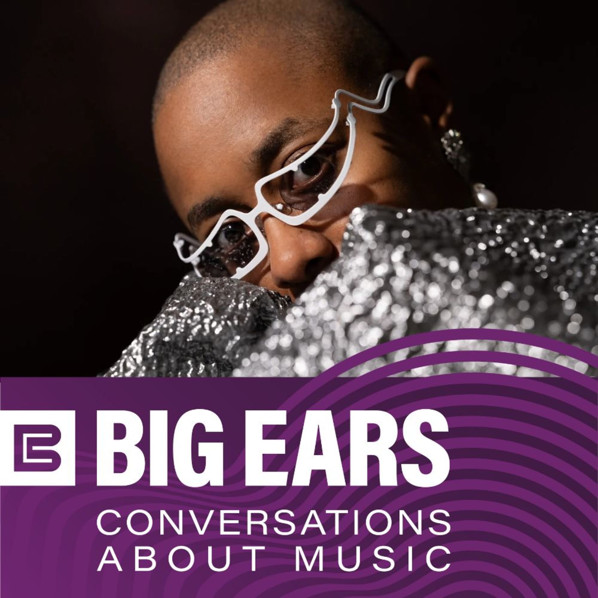 An image of Cécile McLorin Salvant's head from the nose up, with silver fabric covering their mouth. Below that is a purple banner with white text: BIG EARS Conversations About Music