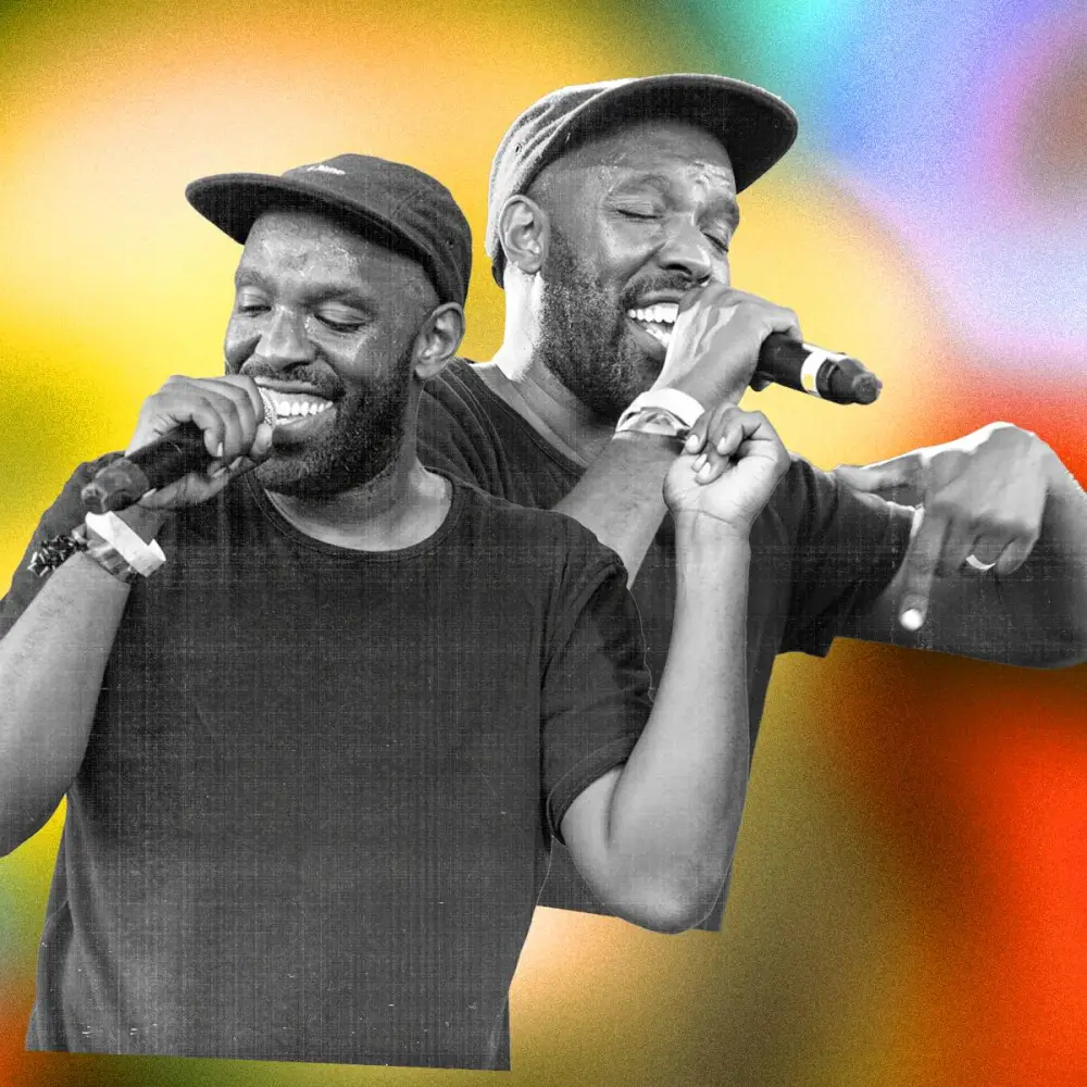 Two black and white images of Shad performing, slightly overlapping, on top of a yellow, orange, and purple gradient background.