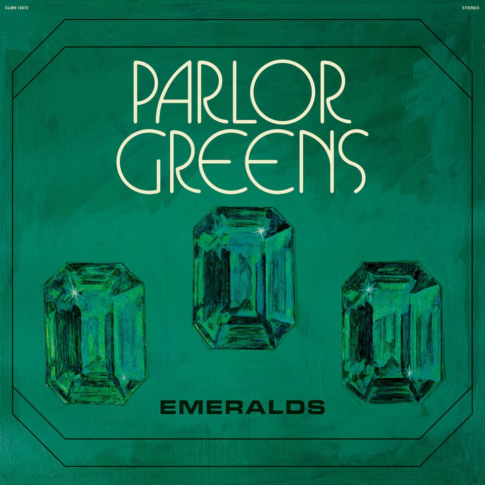 Three green gems painted onto a green background inside of a black frame. "Parlor Greens" is written above in white curved font, and "Emeralds" is written below them in black sans serif font.